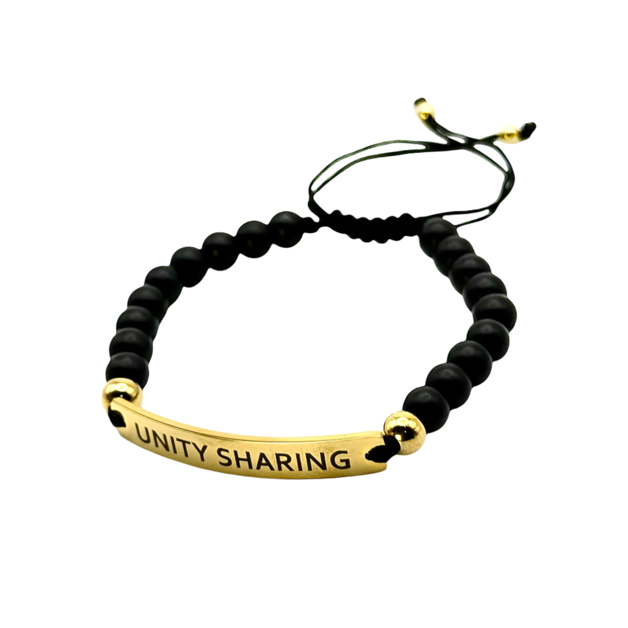 Matte black beaded bracelet with gold “UNITY SHARING” plate and adjustable cord — bold and stylish unisex accessory.
