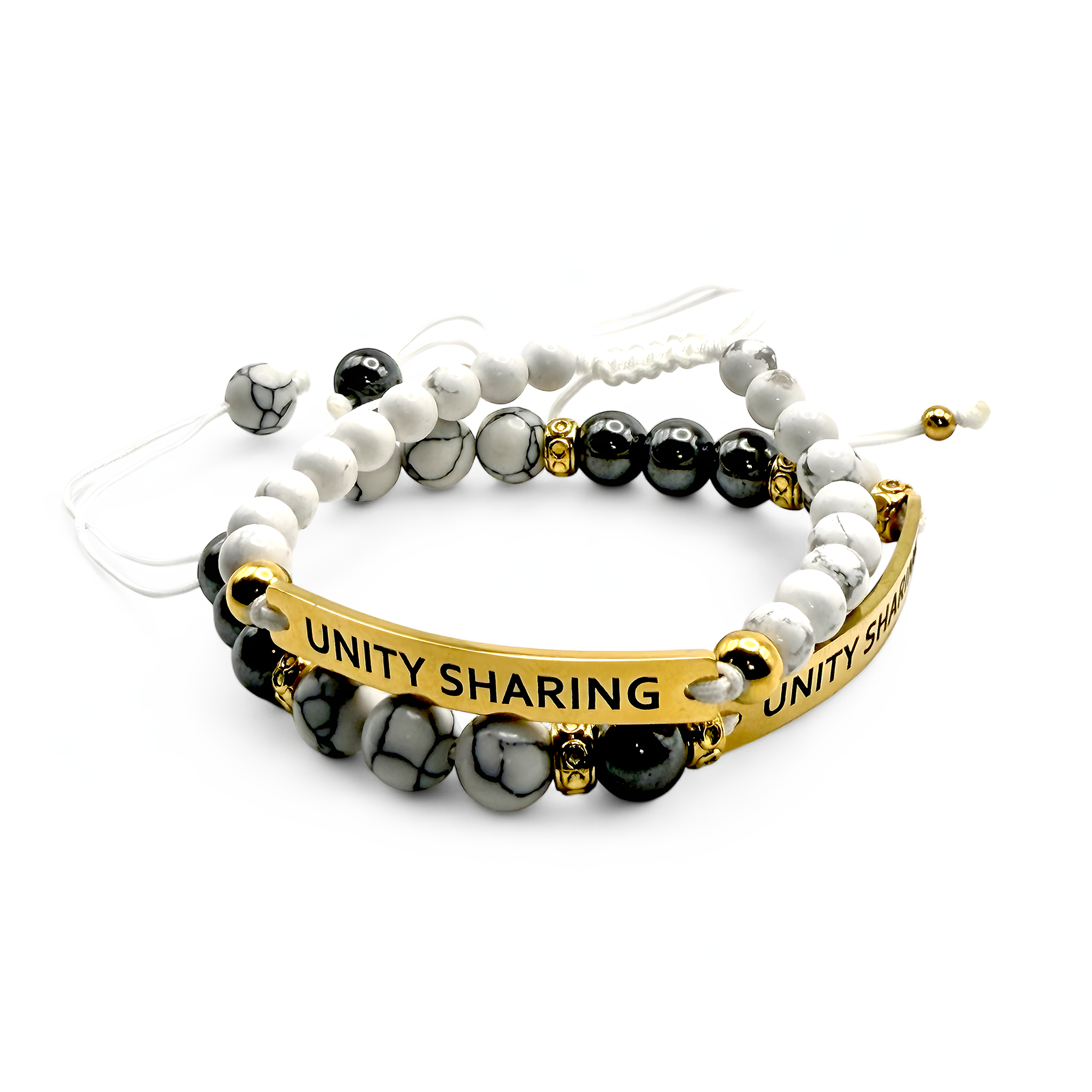 Set of two white beaded bracelets with gold and silver-tone bars engraved “UNITY SHARING” — neutral and stackable bundle.
